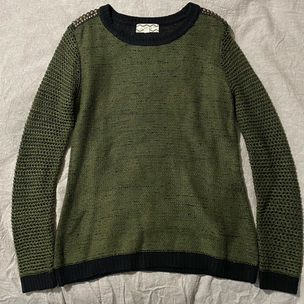 OliveGreen sweater with gold buttons on shoulders and black detailing throughout